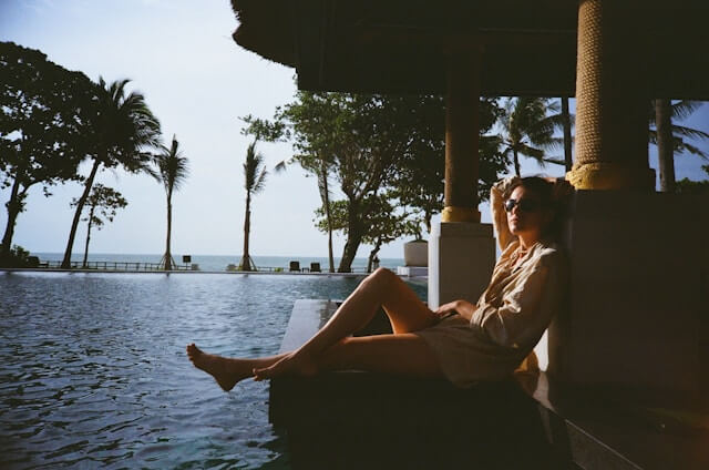Couple enjoying a stylish weekend getaway with scenic views and light luggage