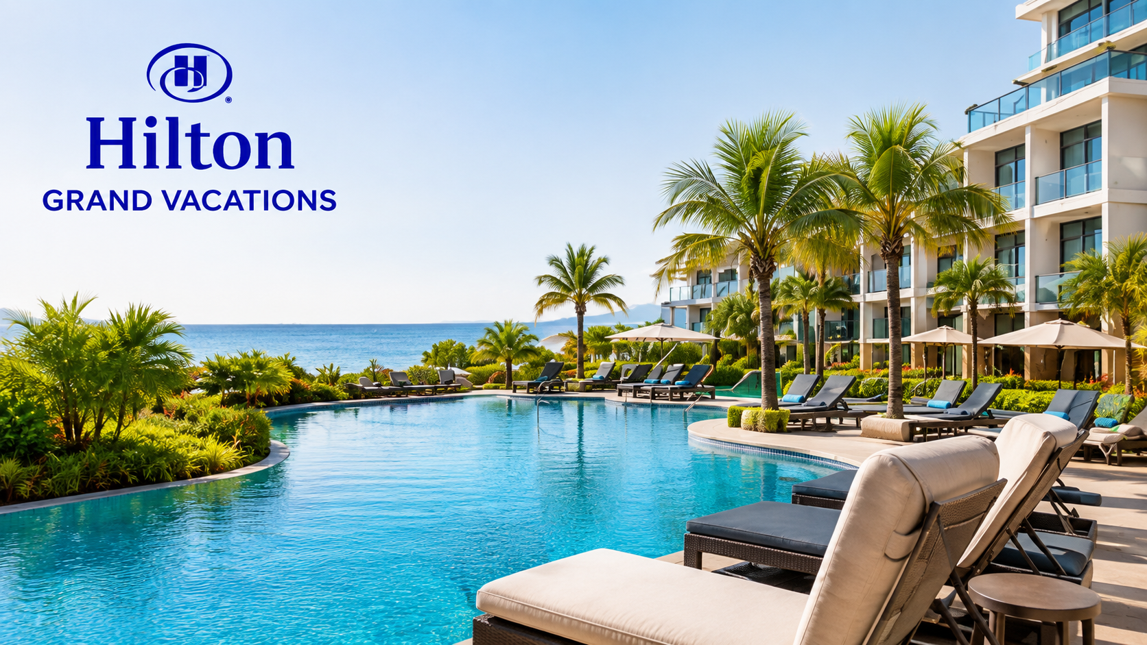 Tropical Hilton-style resort pool and hotel at sunset